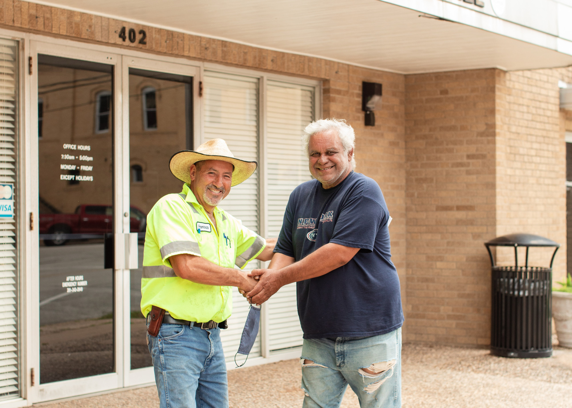 Men shaking hands outside of Richmond city hall